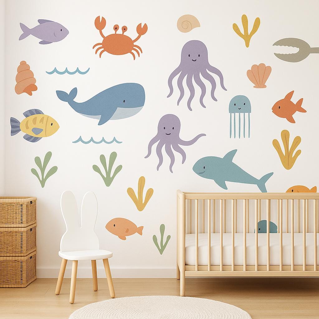 Adorable ocean animal wall decals featuring whales, jellyfish and fish in a nursery decor setting.