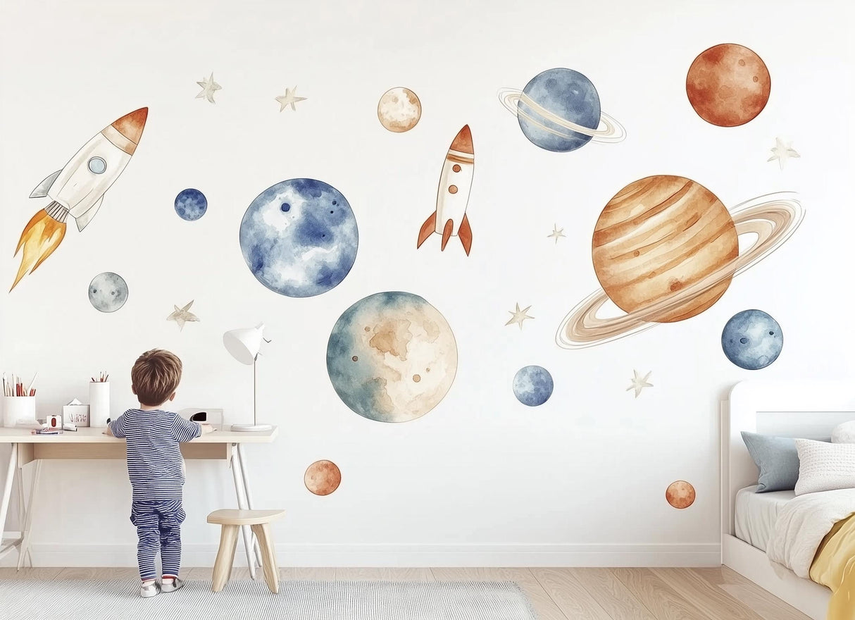 Child admiring watercolor space wall decals featuring rockets and planets, perfect for children's rooms.