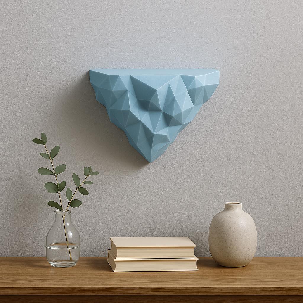 Modern blue geometric wall shelf with a faceted design, perfect for minimalist decor and plant displays.