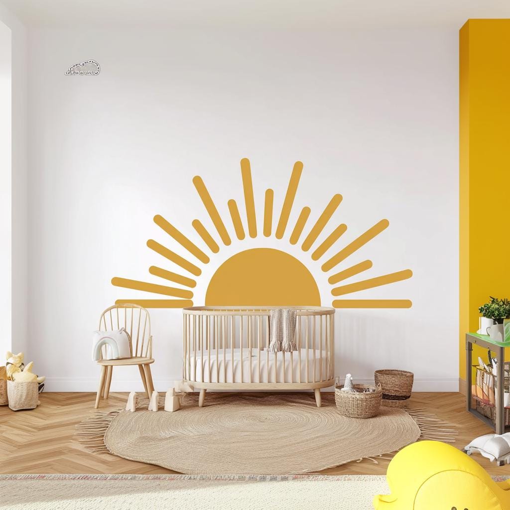 Large half sun wall decal in a bright nursery featuring a crib and playful decor accents.