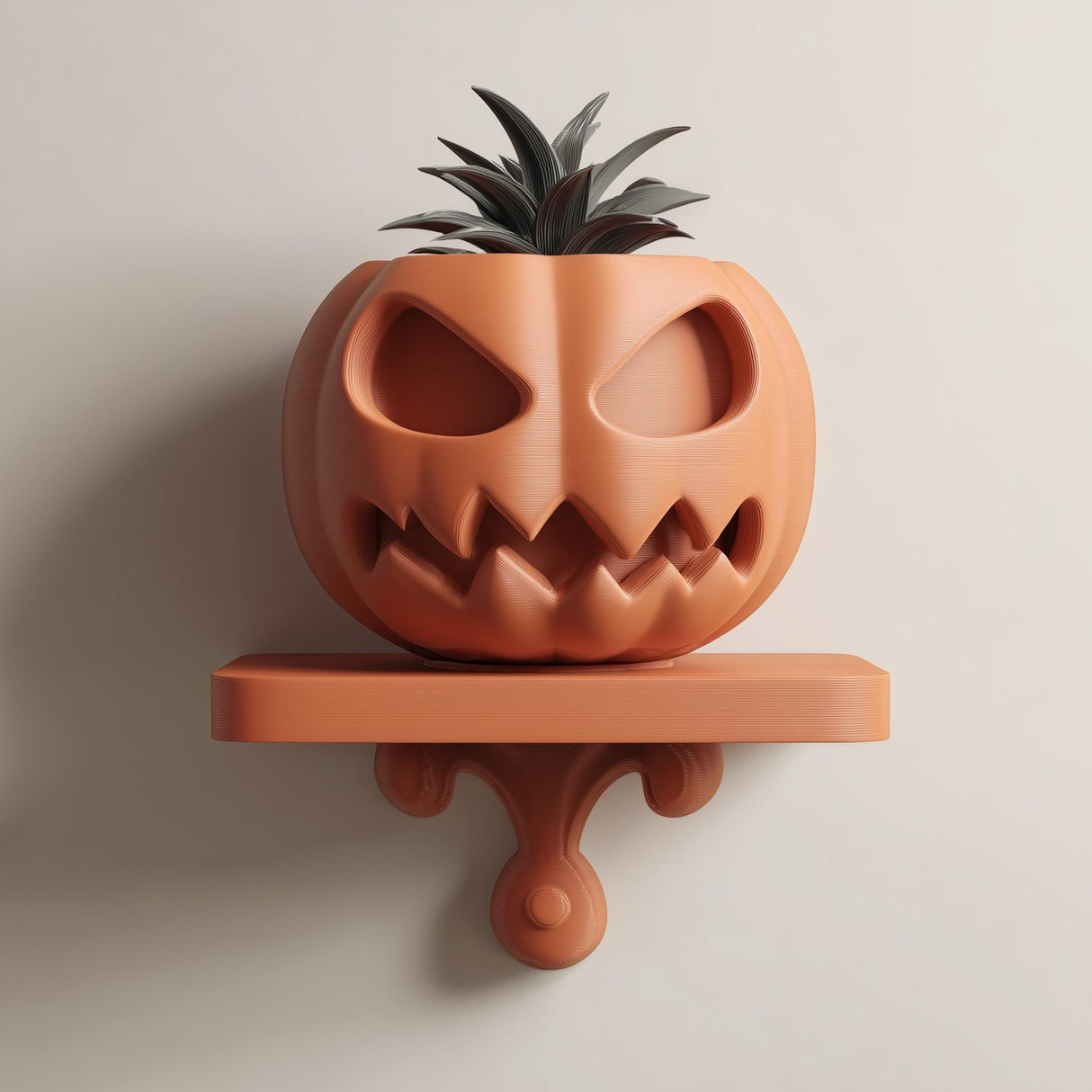3D printed wall-mounted pumpkin face planter shelf with integrated pot and small plant, displayed on a neutral wall in soft natural light.