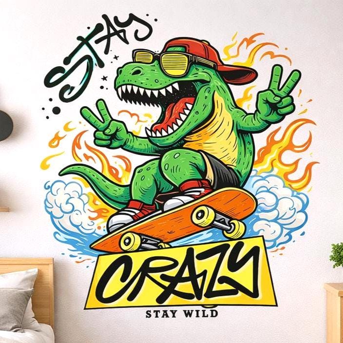 A vibrant, cartoon-style illustration of a green T-Rex dinosaur riding an orange skateboard. The T-Rex wears yellow sunglasses, a red cap, and red sneakers, making peace signs with both hands. It is surrounded by orange flames and blue clouds with the words "STAY CRAZY" in bold black graffiti lettering.