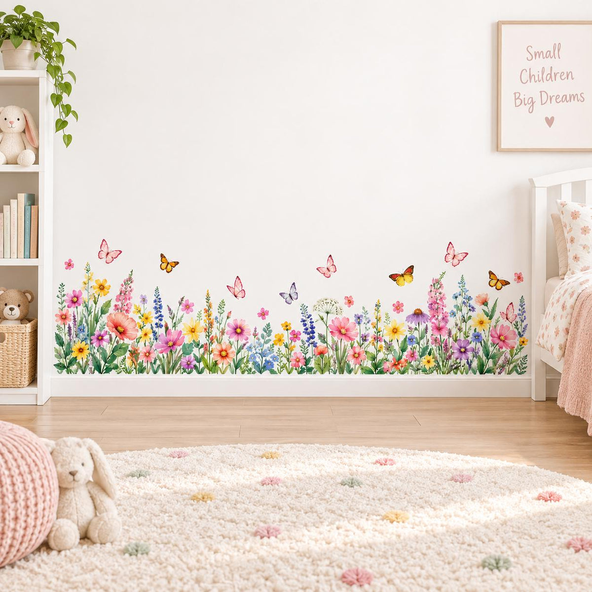 Watercolor wildflower wall border with colorful meadow blossoms, green leaves and butterflies along the base of a wall.