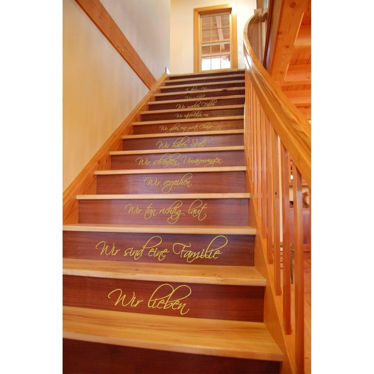 Elegant vinyl decal featuring family quotes on wooden staircase, enhancing home decor with charm.