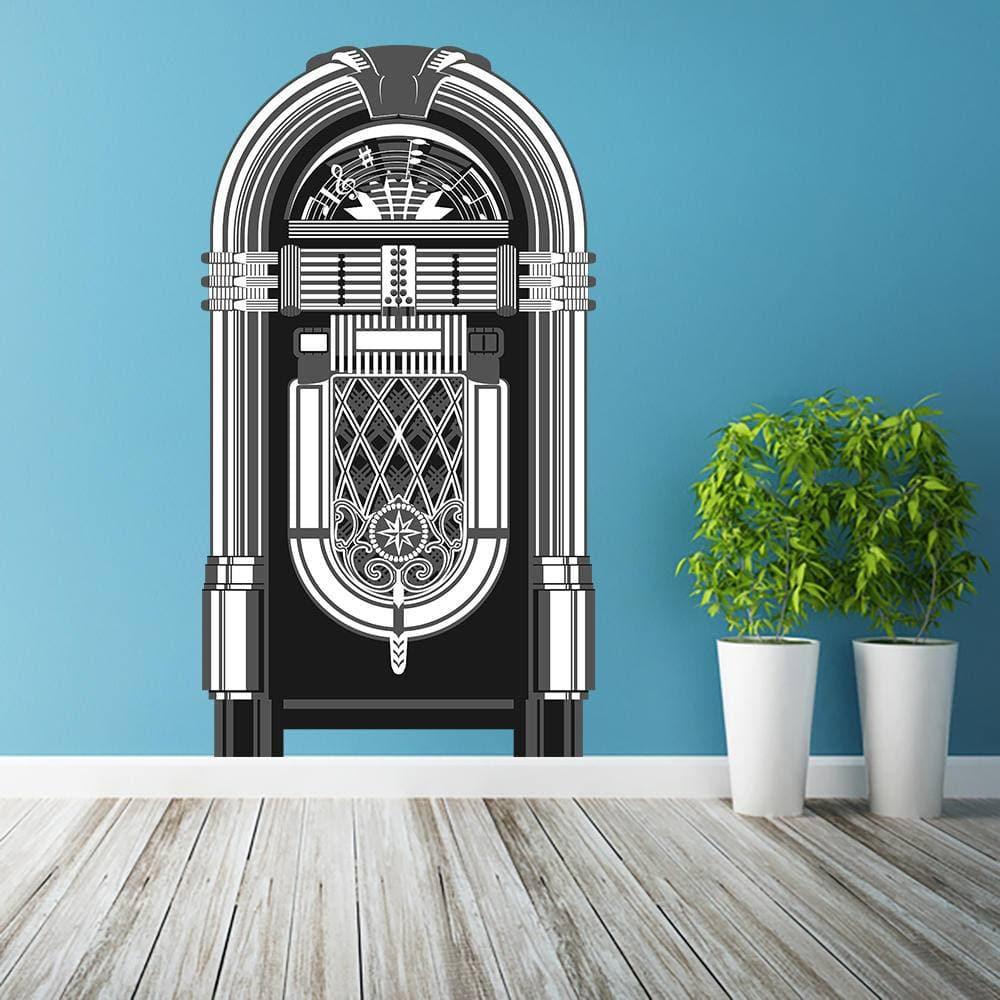Vintage jukebox vinyl wall decal on blue wall with plants, adding retro charm to home decor.