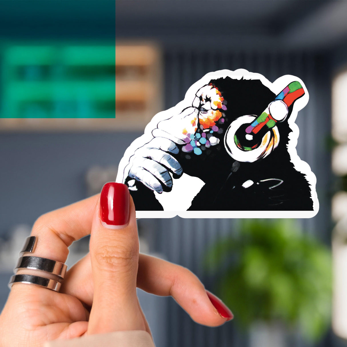 Colorful primate music-themed vinyl sticker decal of a chimp with headphones, perfect for personalizing laptops.
