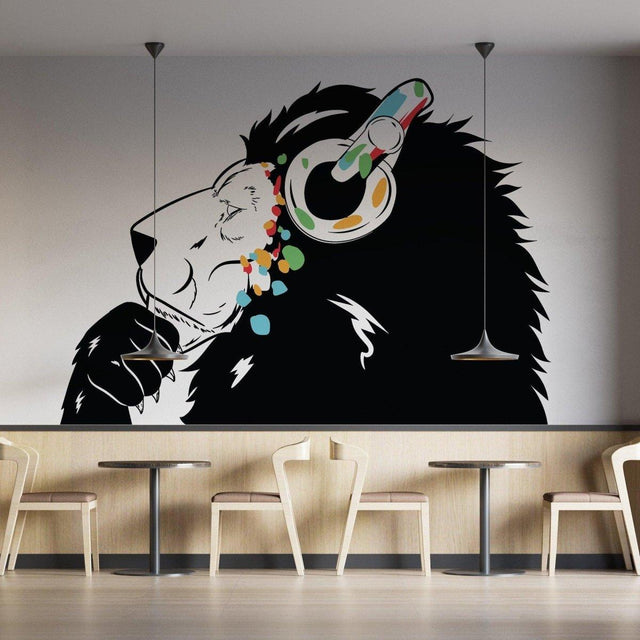Stylish lion wall sticker with headphones in a modern cafe setting, perfect for kids' decor.