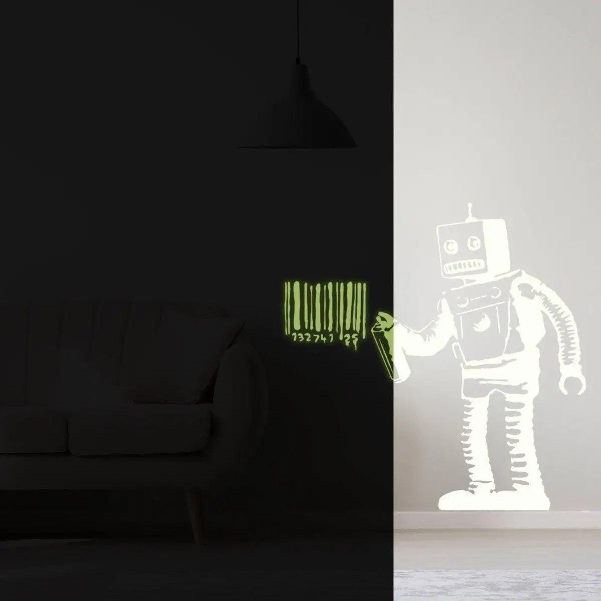 Glow in the dark wall decal of a barcode robot art on a black wall, featuring luminous green details.