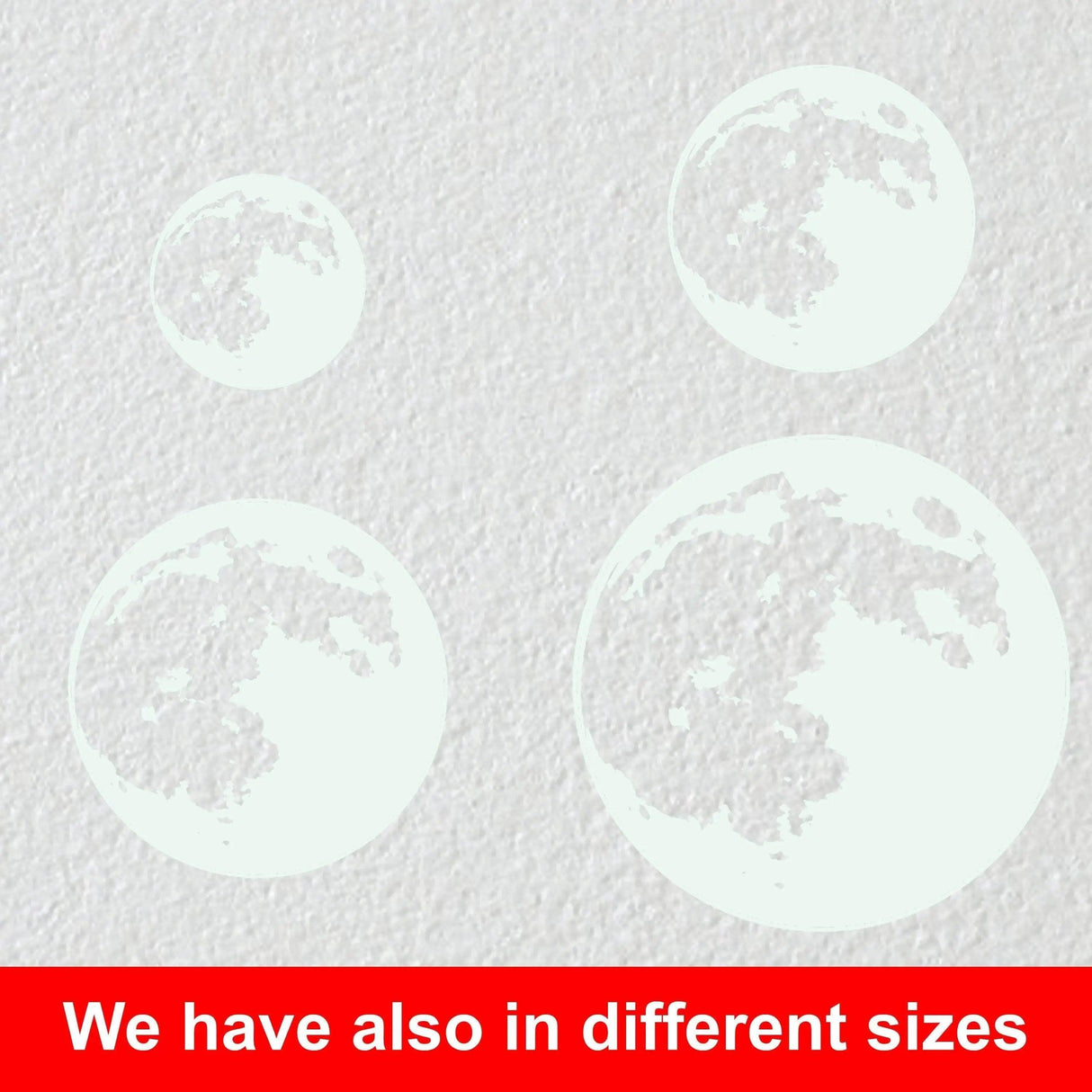 Glow in the dark moon wall decals in various sizes for a celestial-themed room.