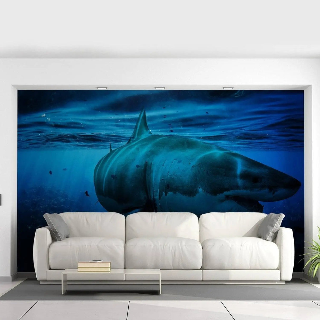 Large shark mural in a living room, creating an underwater paradise wall art effect with a modern couch.