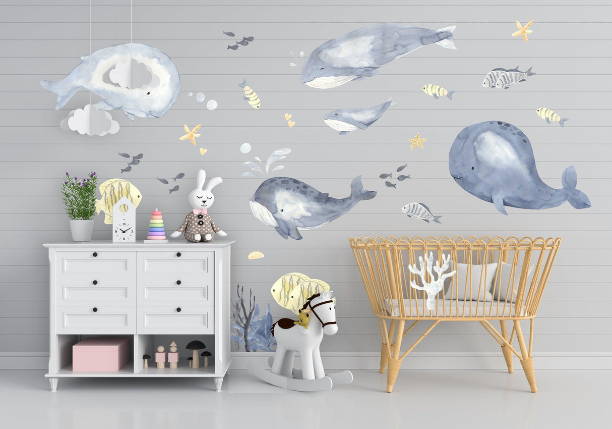 Undersea themed wall decal set featuring whales, fish, and ocean elements in a child's nursery.