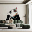 Vinyl sticker art of a panda bear with headphones on a living room wall, adding a fun and colorful decor element.