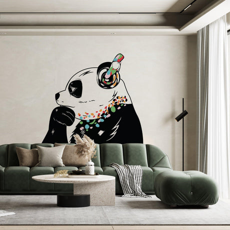 Vinyl sticker art of a panda bear with headphones on a living room wall, adding a fun and colorful decor element.