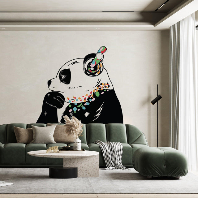 Vinyl sticker art of a panda bear with headphones on a living room wall, adding a fun and colorful decor element.