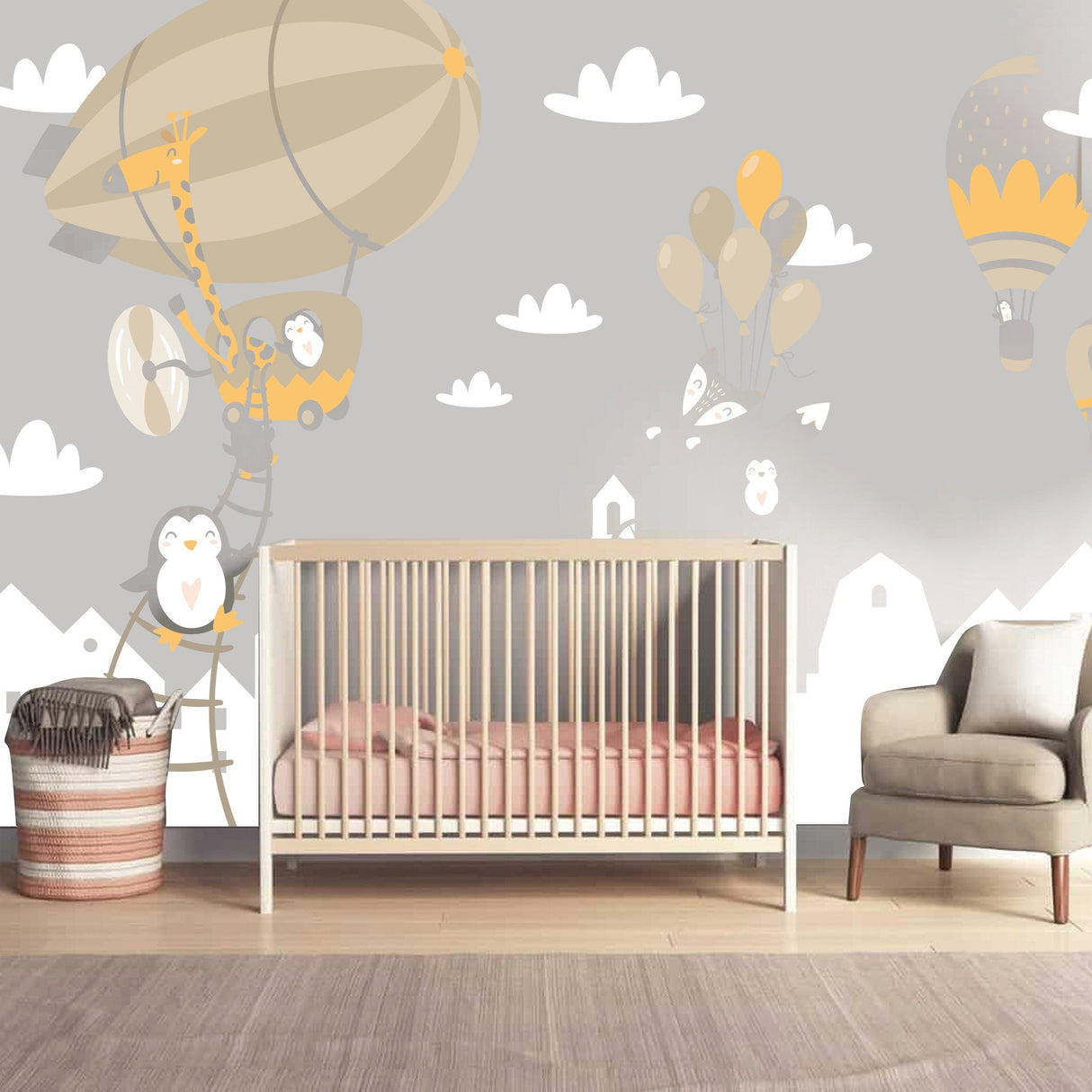 WhimsyLand wall decals featuring balloons and cute penguins above a nursery crib, creating a playful atmosphere.