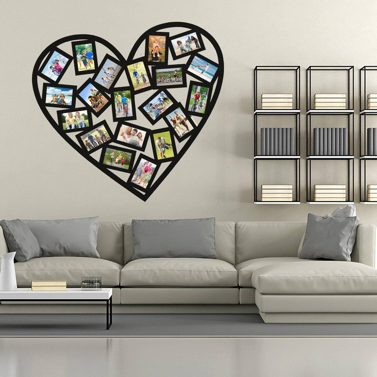 Heart-shaped wall sticker collage with picture frames above a modern gray sectional sofa.