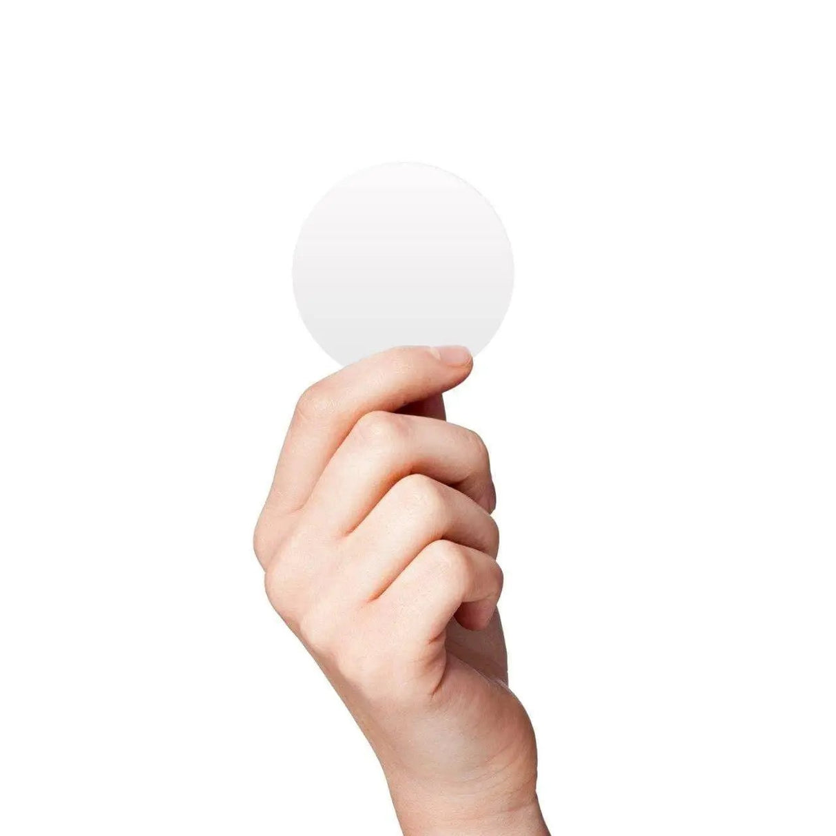 Hand holding a blank circular vinyl decal, ideal for decorative use in kids' rooms.