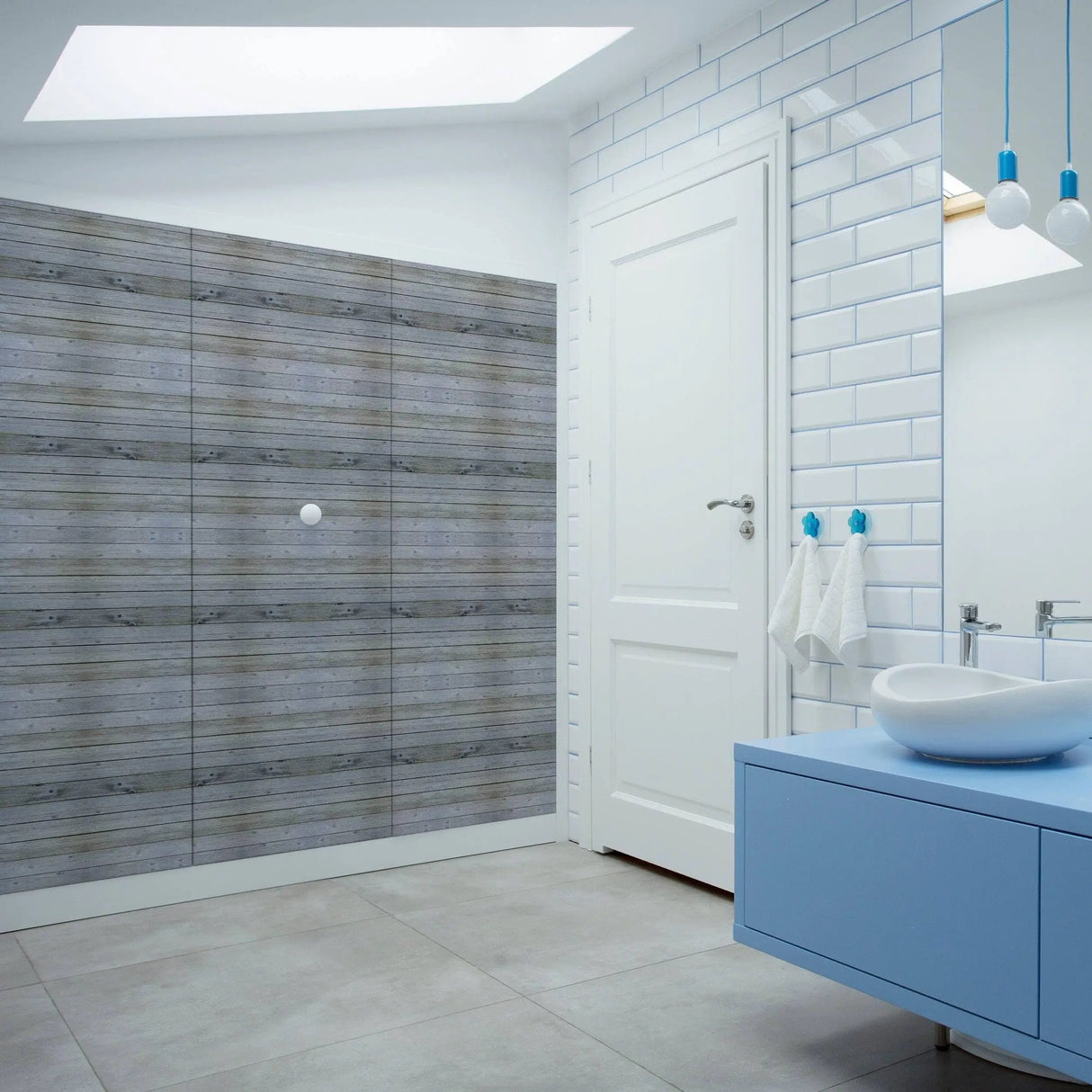 Rustic self-stick wooden plank wall decal in modern bathroom decor, featuring shiplap design and stylish blue fixtures.