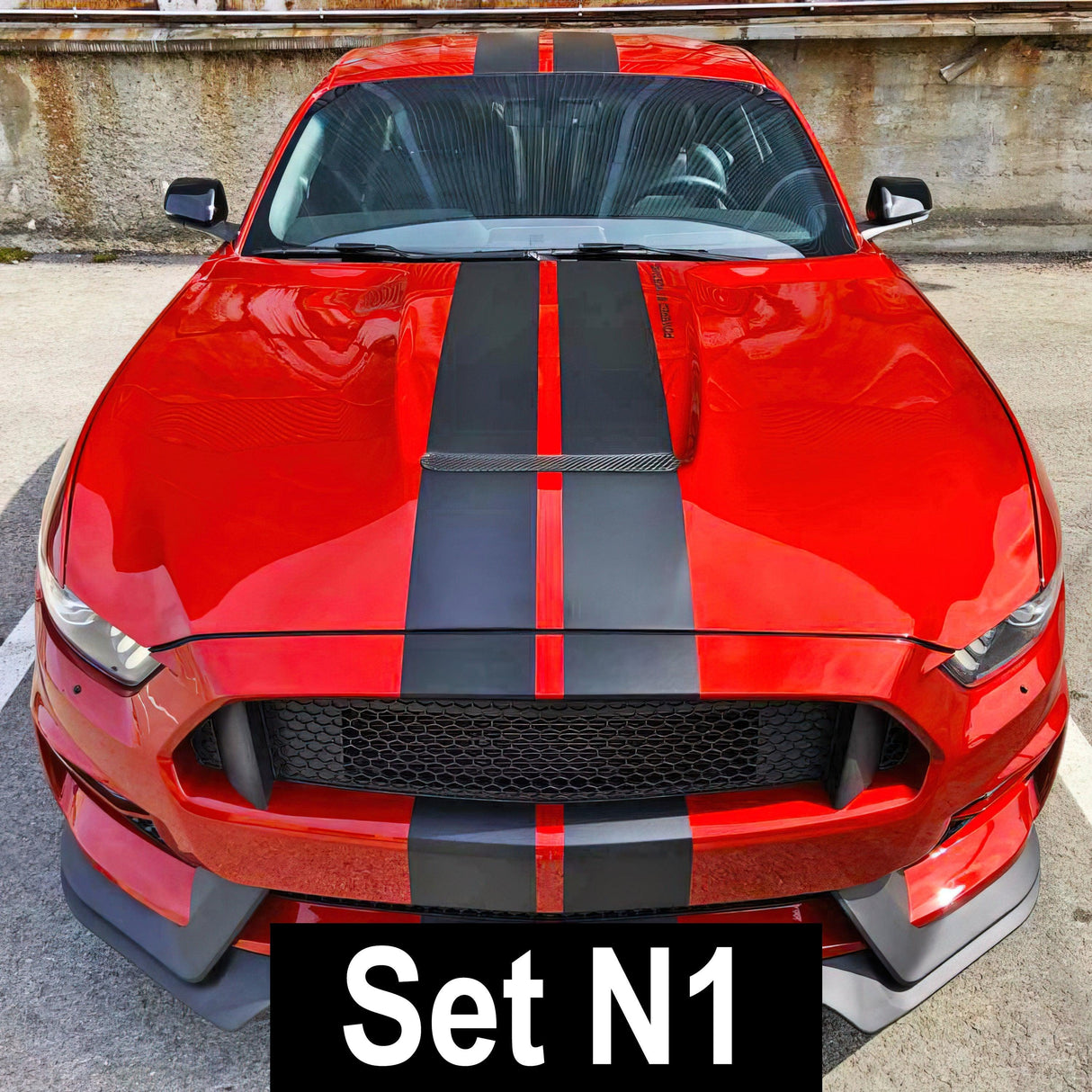Stylish red car with black racing stripes, featuring Set N1 vinyl decals for an upgraded look.