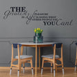 Inspirational vinyl wall decal with motivational quote in stylish dining area, enhancing home decor.