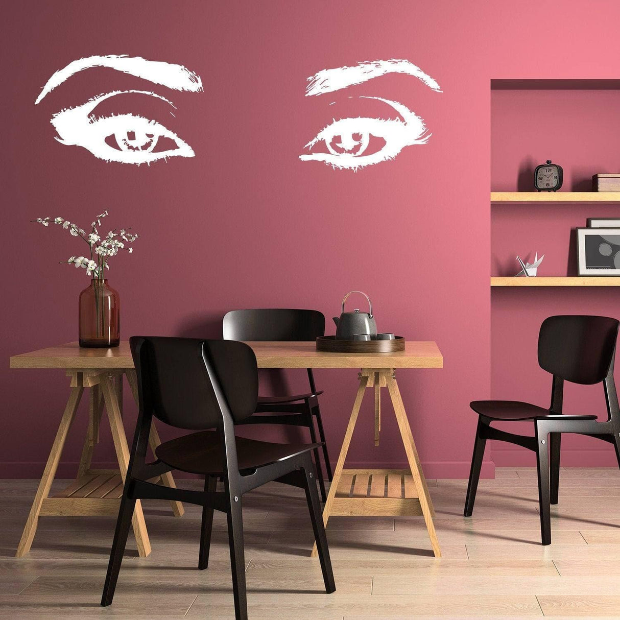 Elegant vinyl wall decal of eyes on pink wall, enhancing room beauty with stylish art.