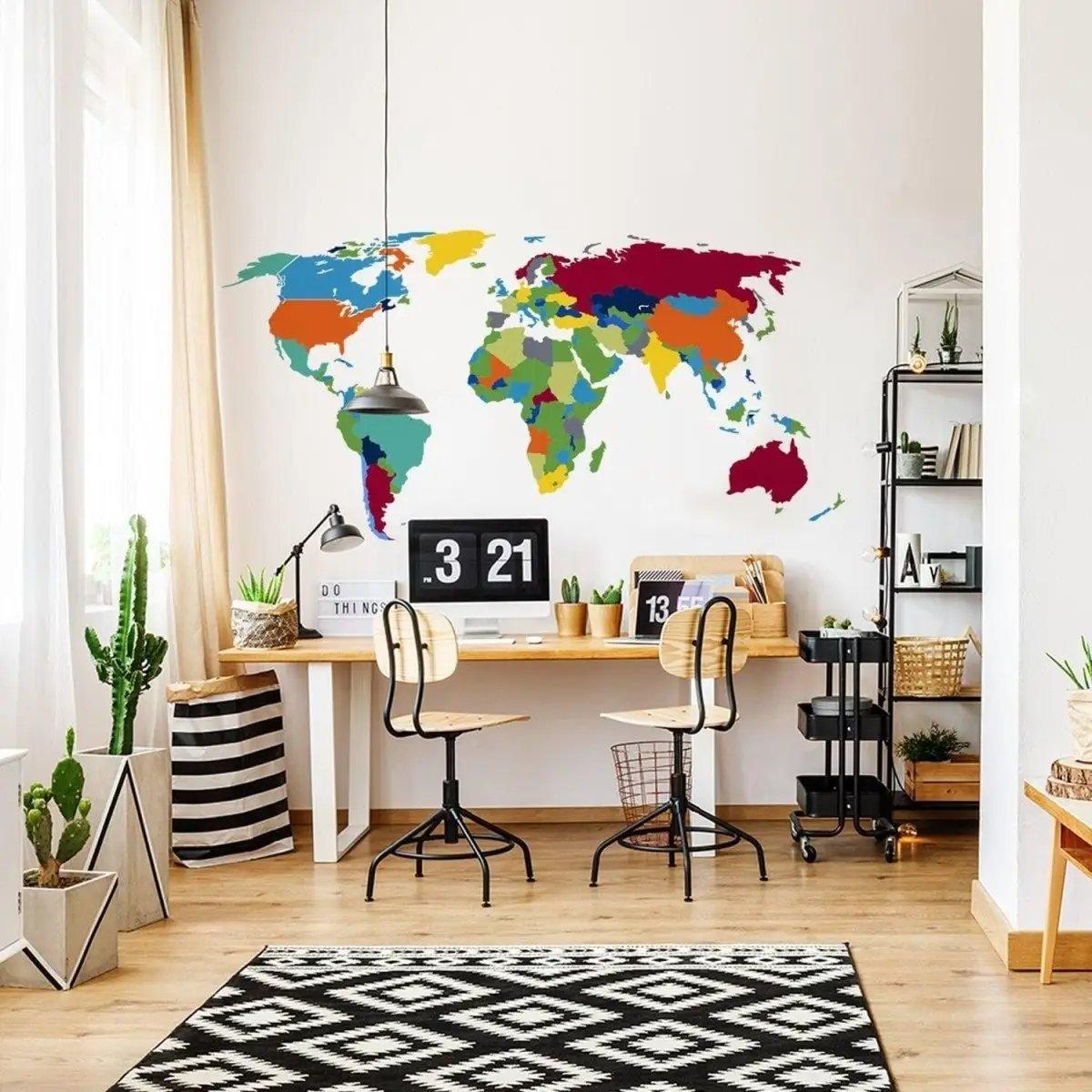 Vibrant world map wall decal in an office space, featuring colorful continents and stylish decor elements.