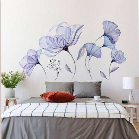 Elegant 3D blue floral wall decal, perfect for home decor, featuring delicate blossoms and leaves on a stylish bedroom wall.