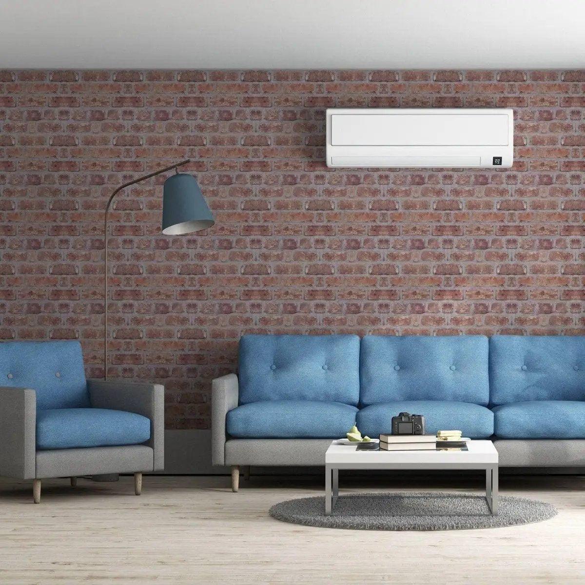Living room with blue furniture and brick wall transformation using 3D wall wallpaper kit.