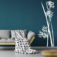 Bamboo wall art decal on a blue wall, featuring a modern living space with a sofa and polka dot blanket.