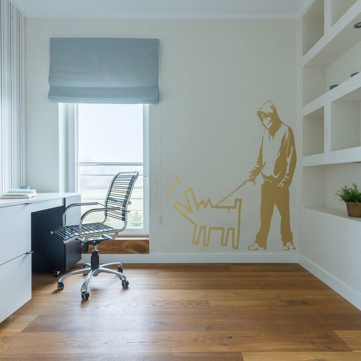 Banksy wall art decal in a modern office, featuring a figure walking a dog on a wall.