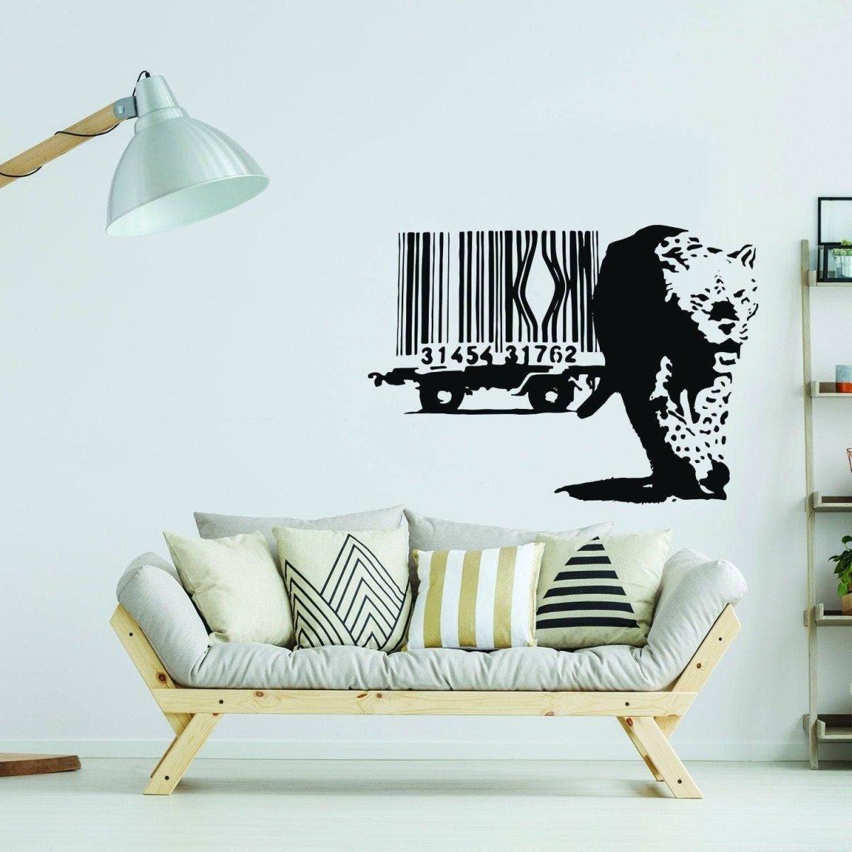 Artistic leopard barcode wall sticker design on white wall above a stylish sofa with decorative cushions.