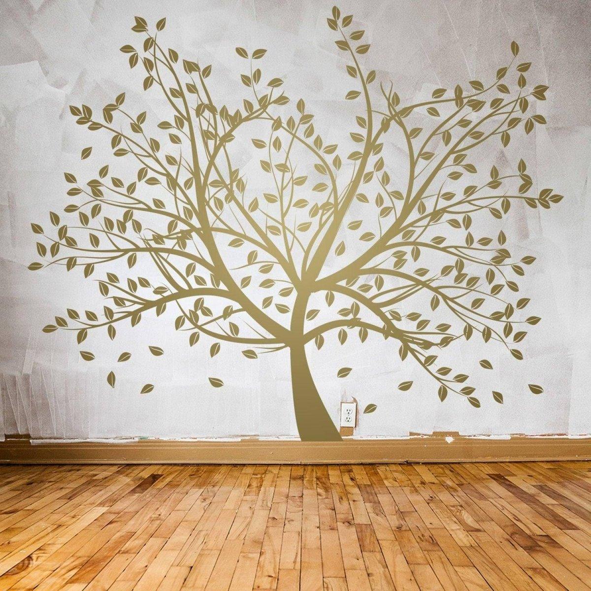 Birch Grove Vinyl Wall Decal featuring a large tree design with leaves on a textured wall in a cozy room.