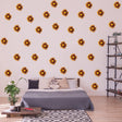 Boho Blossom Daisy wall stickers in a stylish bedroom, featuring vibrant brown flower decals on white walls.