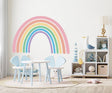 Boho aesthetic rainbow wall sticker in a kid's room, adding color and charm to the nursery decor.