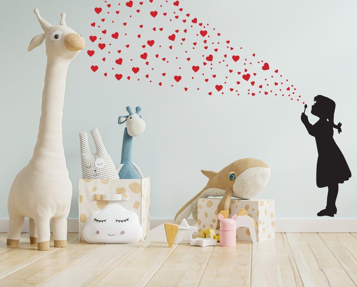 Graffiti art wall decal featuring a girl blowing heart bubbles in a playful children's room setting.