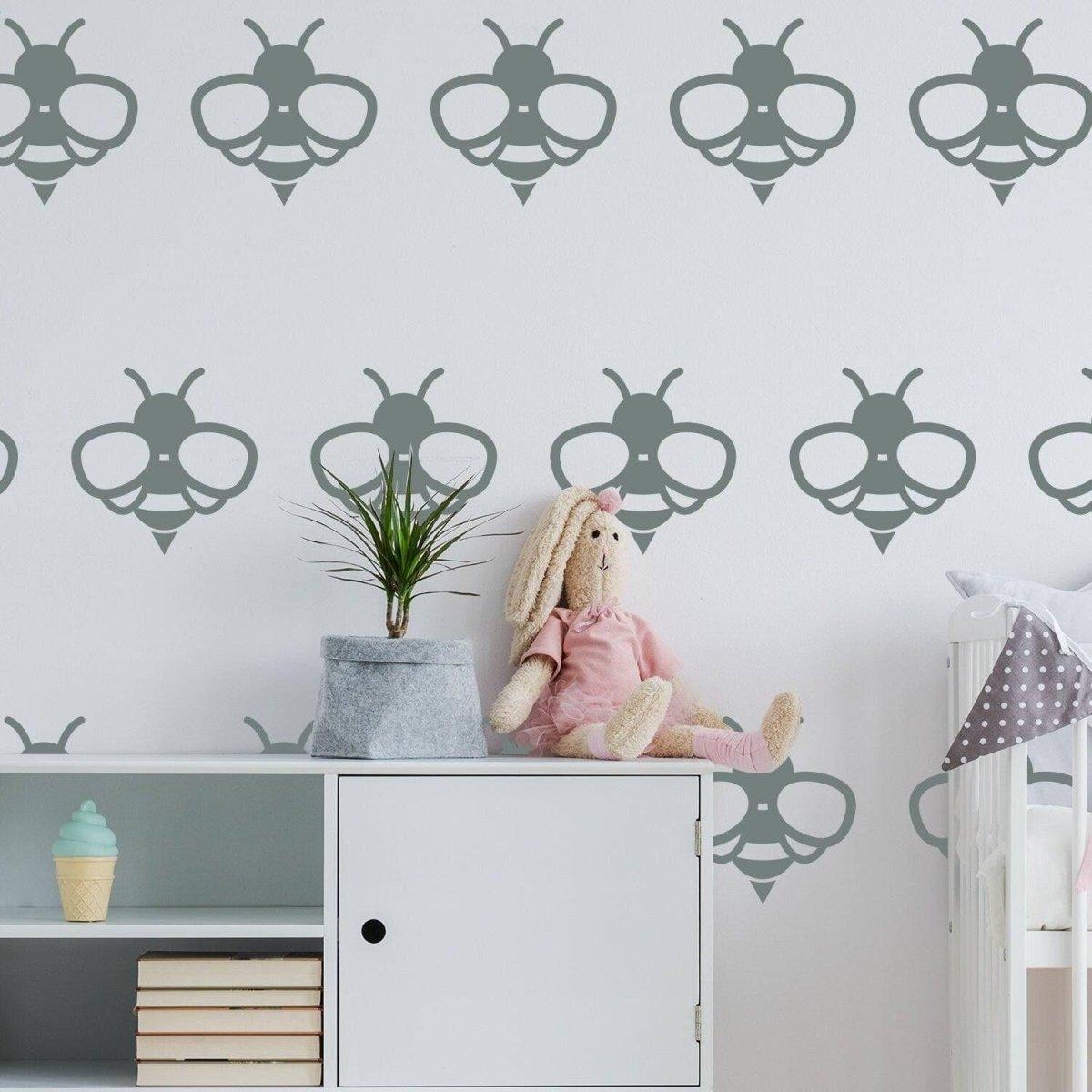 Cute bee wall decals on a nursery wall, adding charm to the interior with a plush bunny on a shelf.