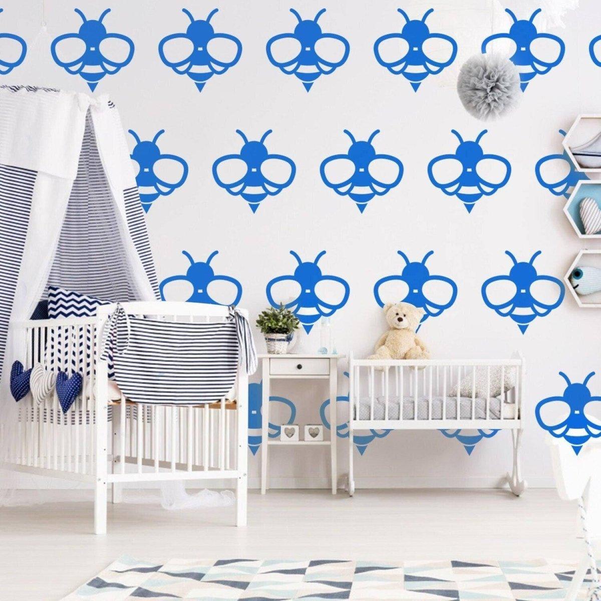 Blue bee wall decals in a nursery, featuring a cute, playful design for vibrant interior decoration.