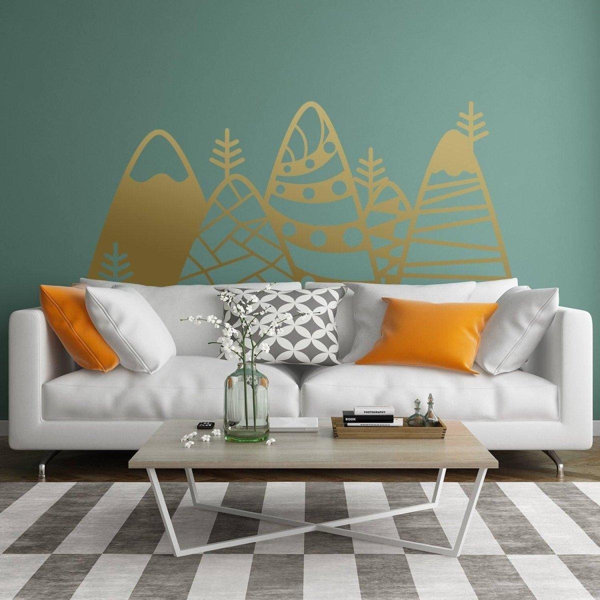 Peaks wall sticker featuring golden mountain decals above a stylish sofa, enhancing room decor with a modern touch.