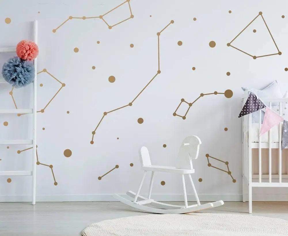 Celestial-themed nursery with constellation wall stickers and golden star decals, enhancing the interior decor.