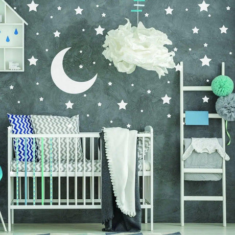 Celestial Dreams wall sticker collection featuring white stars and moon decor in a stylish nursery room.