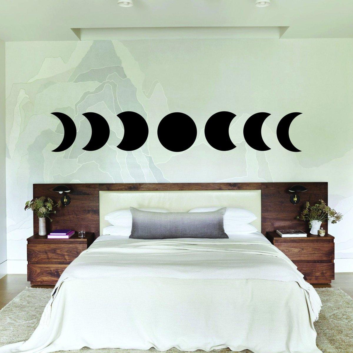 Moon phase wall décor stickers in a modern bedroom, adding celestial charm and personality.
