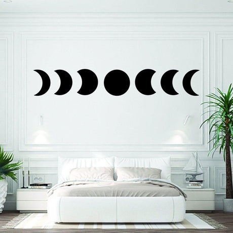 Moon phase wall hanging decor in a modern bedroom, featuring celestial lunar artwork sticker.