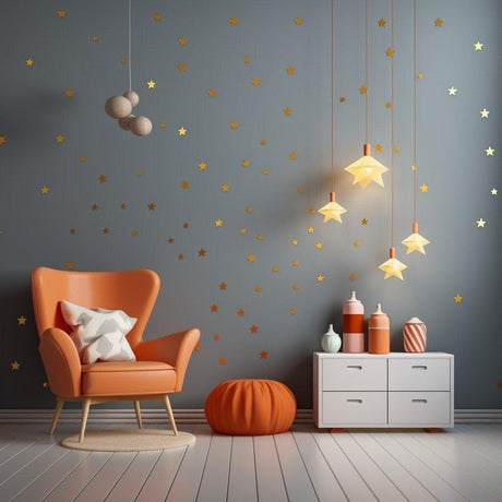 Cozy room with orange chair, star wall decals, and pendant lights, showcasing Gold Stars Vinyl Wall Stickers.