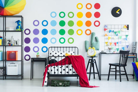 Colorful circle wall decals in vibrant shades brighten up a modern bedroom decor with playful accents.