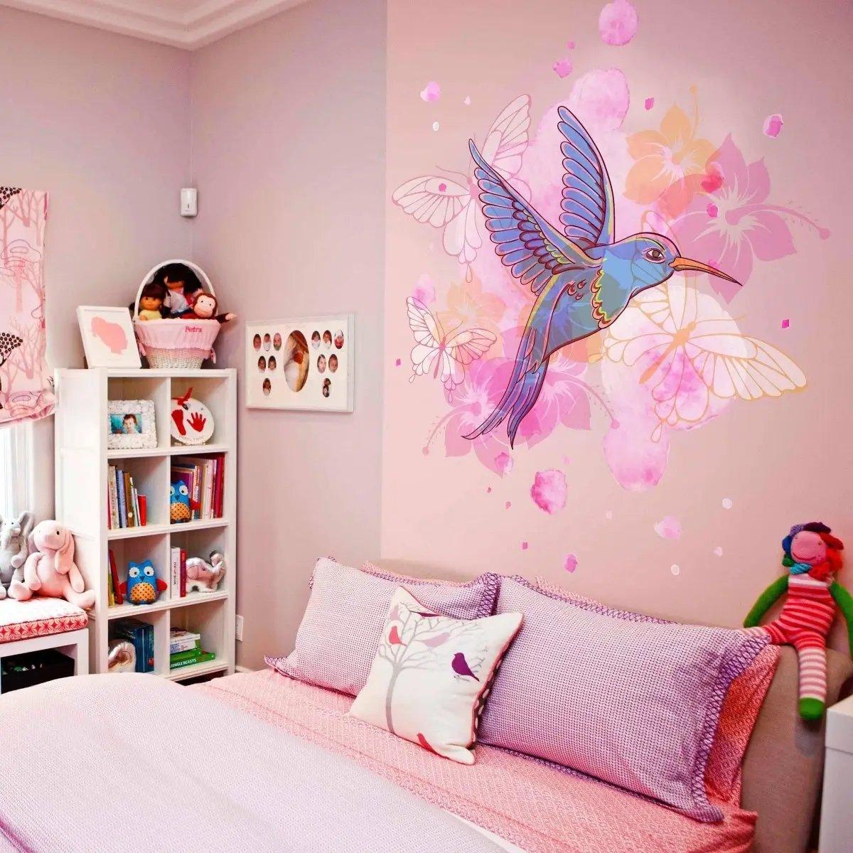 Colorful hummingbird wall vinyl sticker in a cozy bedroom, adding charm to home decor with floral accents.