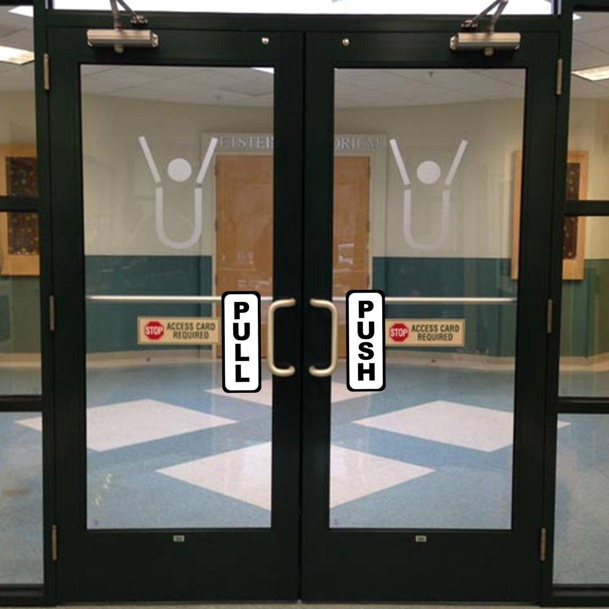 Commercial door with clear pull and push stickers for easy access, ideal for offices and public spaces.