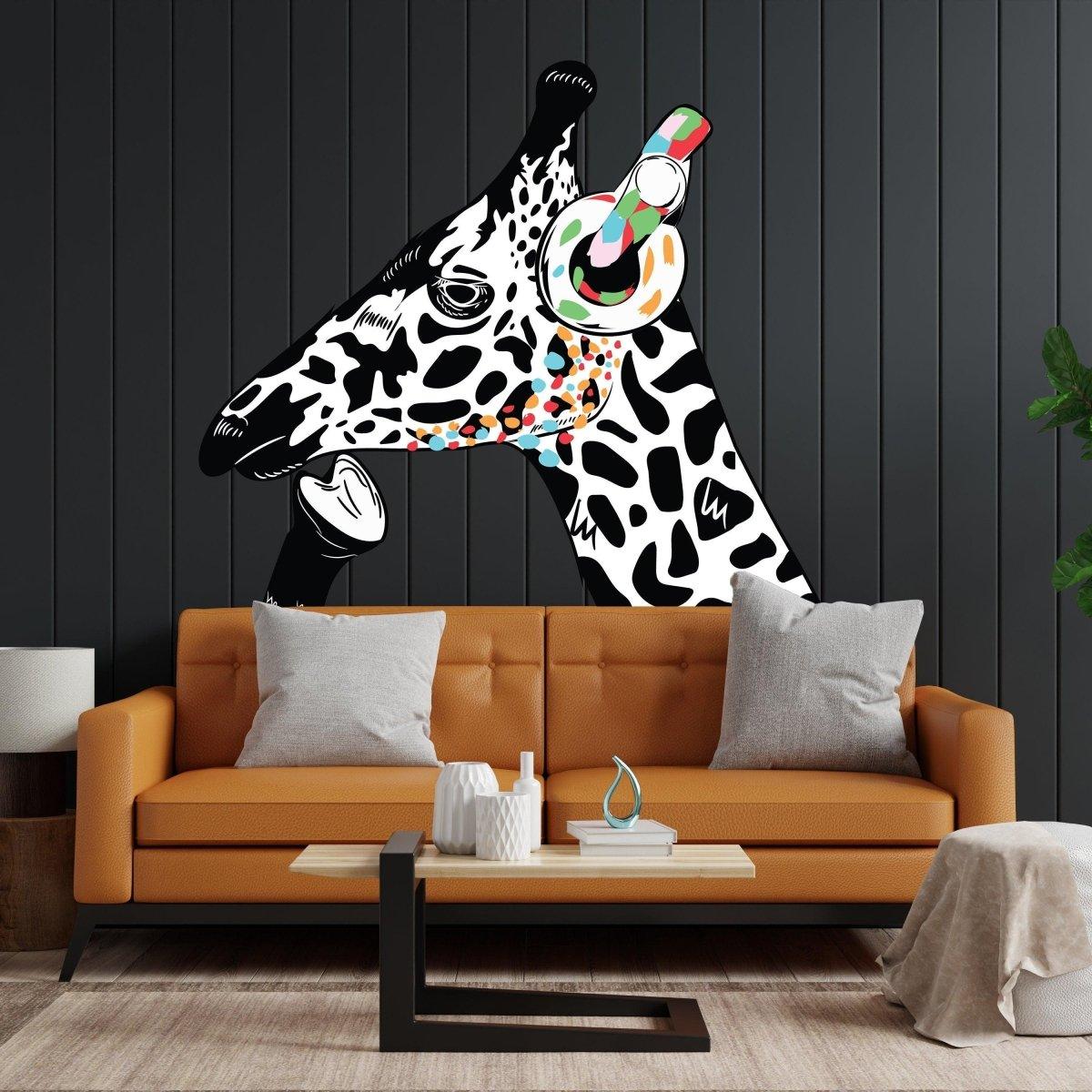 Contemplative giraffe wall sticker with headphones on a black wall above an orange sofa, adding creativity to children's space.