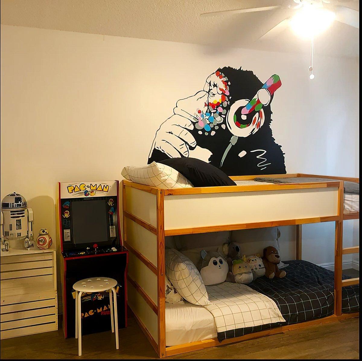 Cool contemplative monkey wall decal with headphones in kids' room, adding personality and fun to the decor.