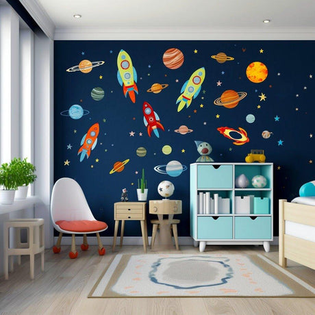 Colorful galaxy-themed wall stickers featuring rockets, planets, and stars in a children's room.