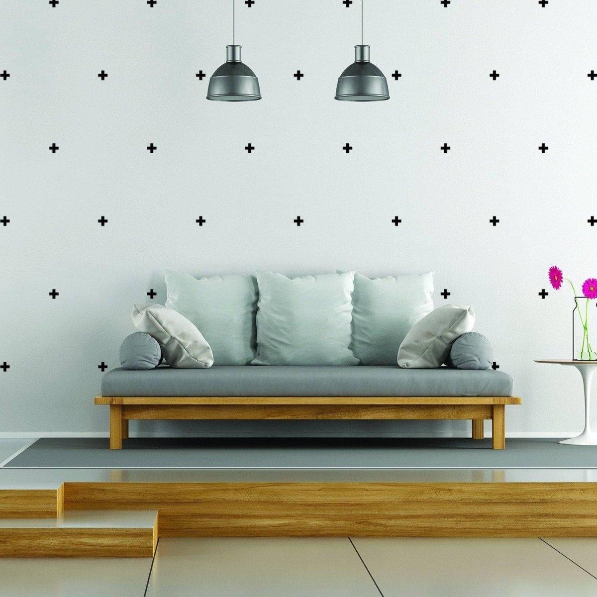Stylish living room with Adhesive CrossLine Vinyl Wall Decals and modern sofa, showcasing creative home decor.
